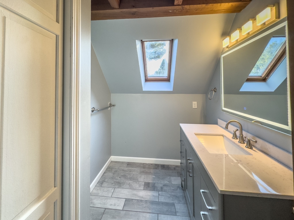 526 Station Road Amherst, MA 01002 - Photo 36 of 42 a bathroom with a sink and a mirror