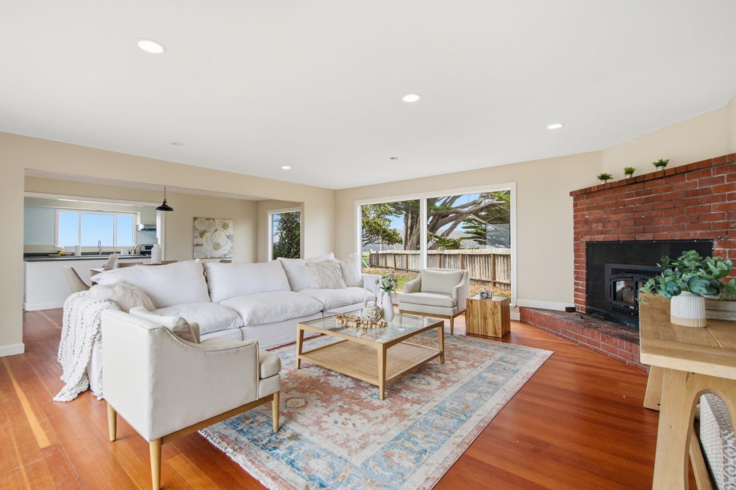1263 Reservoir Road Pescadero, CA 94060 - Photo 24 of 66 a living room with furniture a fireplace and a table