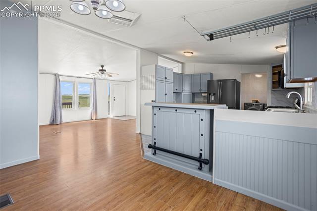 7855 Edison Road Yoder, CO 80864 - Photo 8 of 16 Dining Room Looking into Living Room & Kitchen