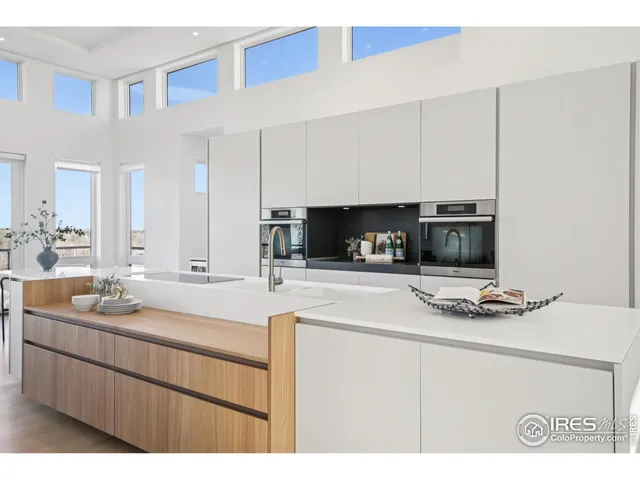 a kitchen with stainless steel appliances a stove a sink and a microwave