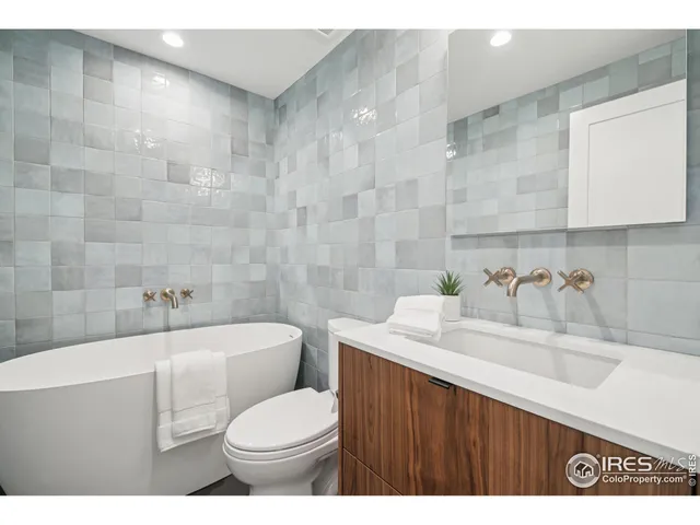 a bathroom with a sink a toilet and a bathtub