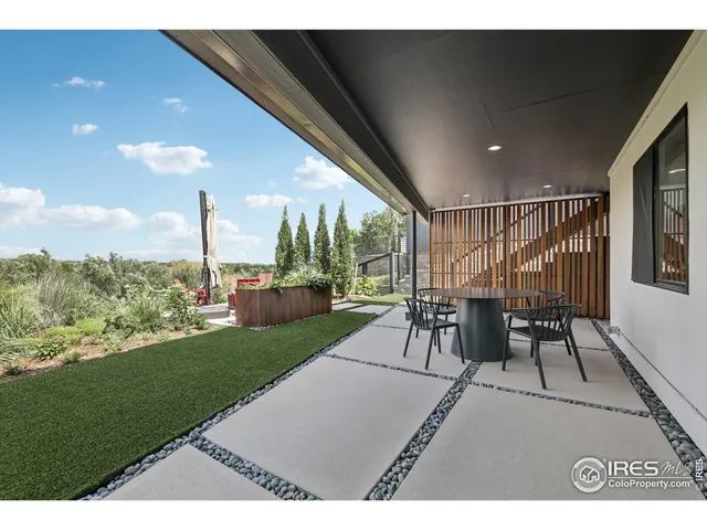 a view of a patio with a backyard