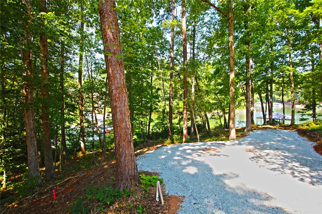 1359 Hbr Rdg Road Seneca, SC 29672 - Photo 37 of 39 A tranquil wooded lot offers serene water views and direct lake access, perfect for a custom build.