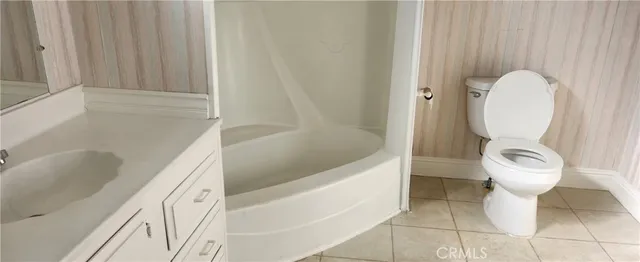 a bathroom with a toilet sink and bathtub