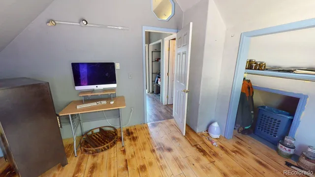 a bed room with a bed and a television