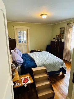 a bedroom with a bed and furniture