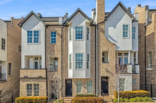 a view of residential houses with glass windows