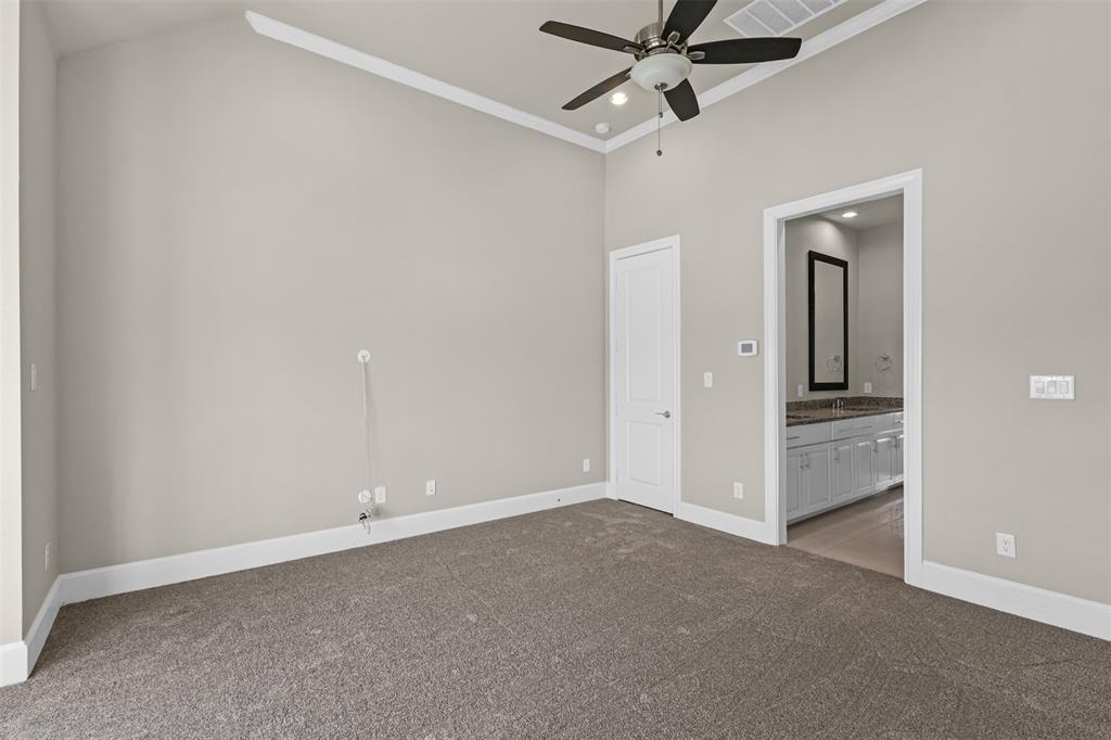 2238 Alterbrook Lane Dallas, TX 75219 - Photo 11 of 19 an empty room with closet and a chandelier fan
