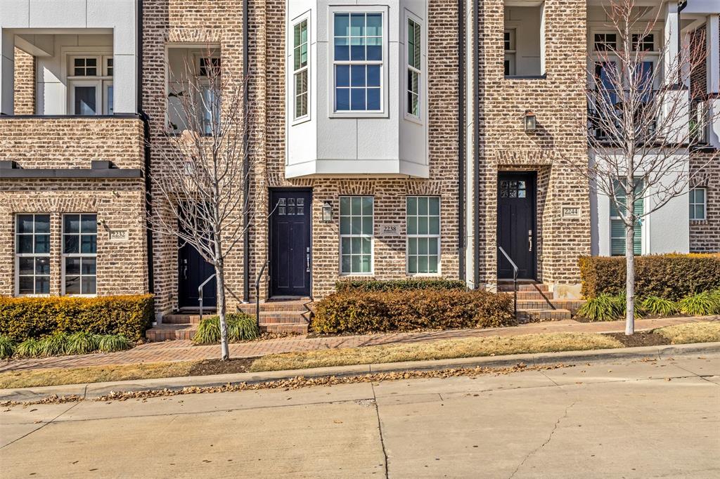2238 Alterbrook Lane Dallas, TX 75219 - Photo 2 of 19 a view of a brick house with large windows