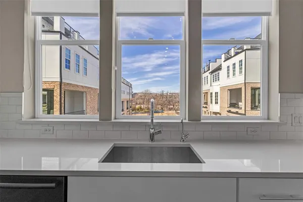 a view of a sink and a window