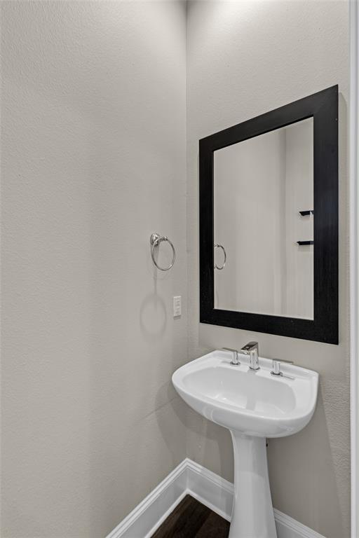 2238 Alterbrook Lane Dallas, TX 75219 - Photo 7 of 19 a bathroom with a sink and a mirror