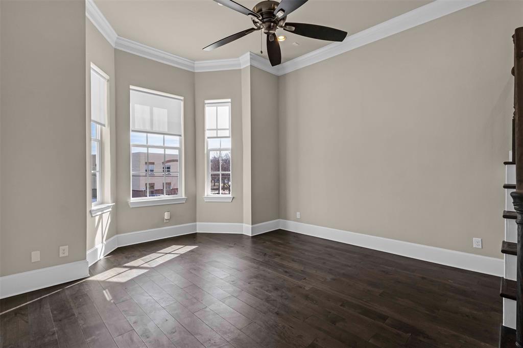 2238 Alterbrook Lane Dallas, TX 75219 - Photo 8 of 19 a view of an empty room with wooden floor and a window