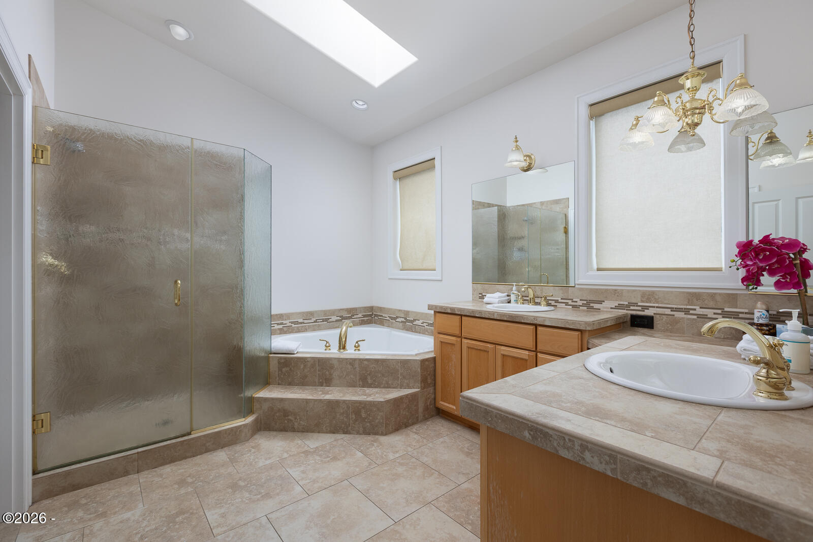 7415 East Summit Road Pacific City, OR 97135 - Photo 18 of 44 a bathroom with a granite countertop sink a mirror a bathtub and shower