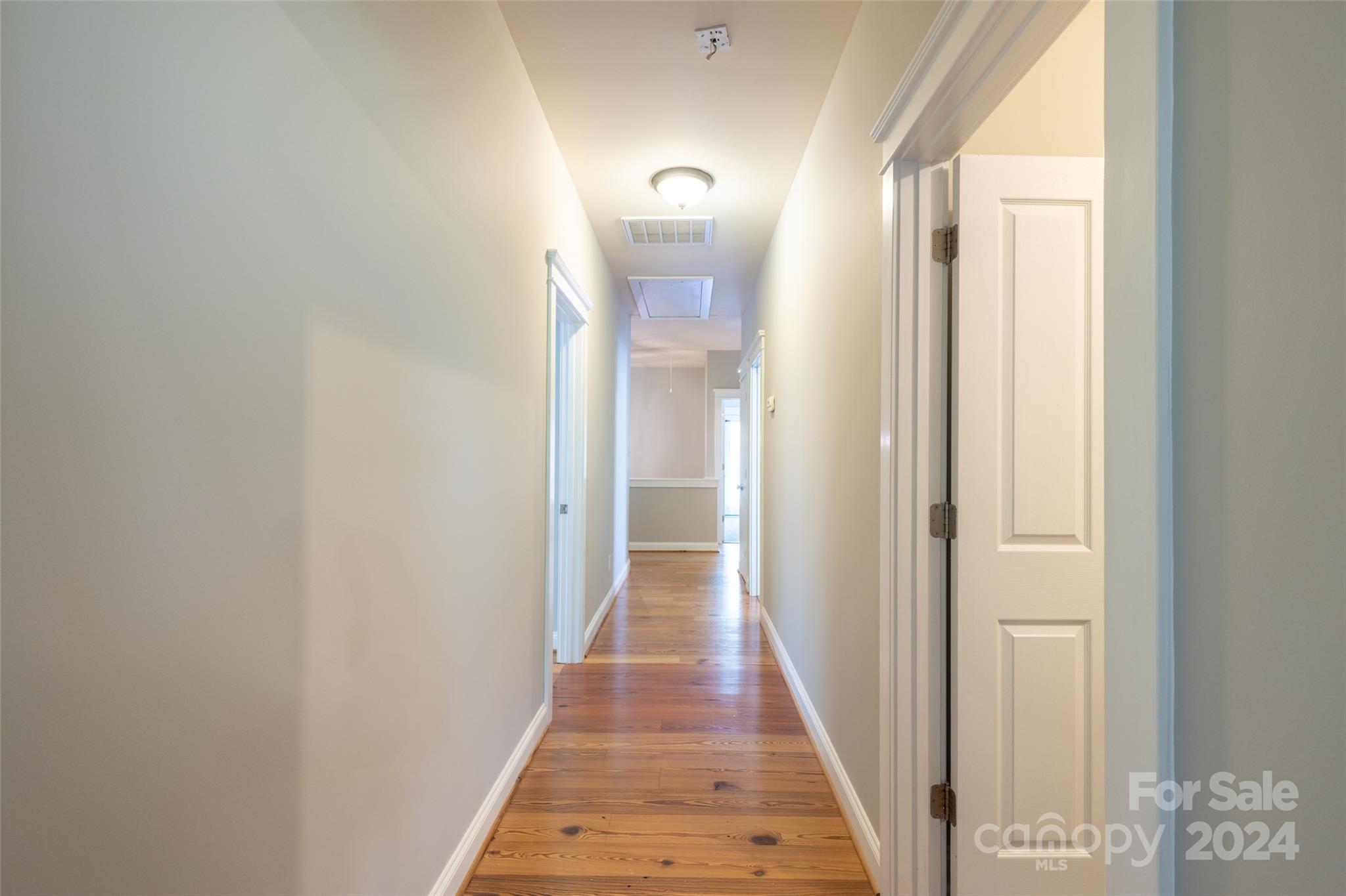 539 Fourth Baxter Crossing Fort Mill, SC 29708 - Photo 38 of 47 a view of a hallway with wooden floor and glass door