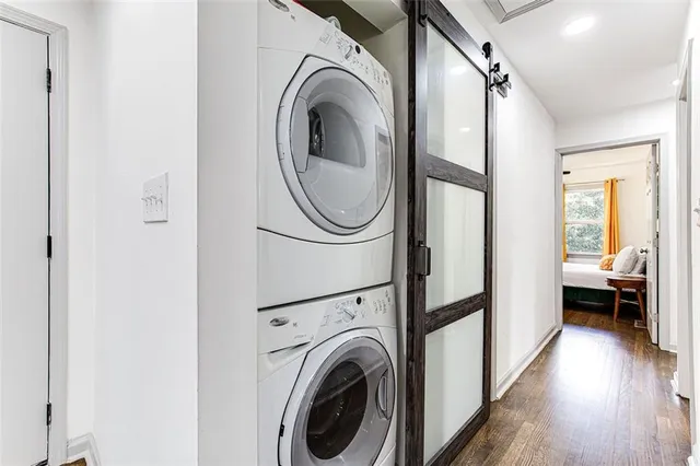 a view of a hallway with washer and dryer