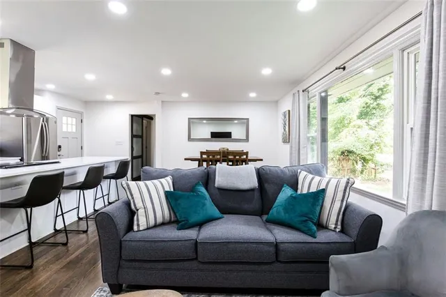 a living room with furniture and a large window