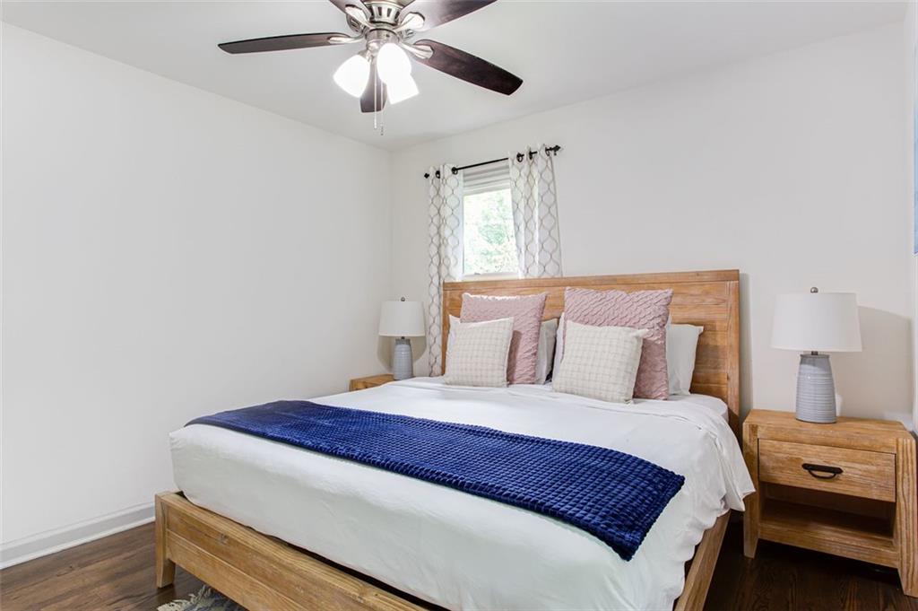 1300 Wichita Drive Southwest Atlanta, GA 30311 - Photo 5 of 10 a bedroom with a bed and a chandelier