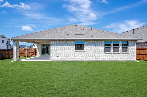 a view of a house with backyard porch and sitting area