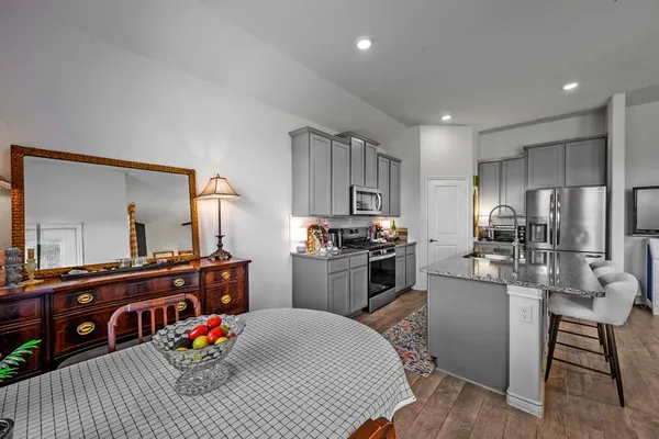 a living room with furniture and a table