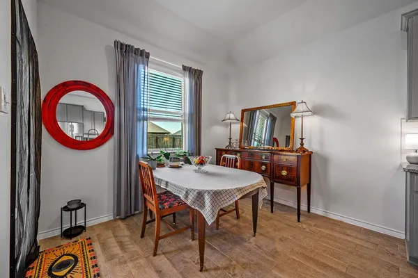 a kitchen with stainless steel appliances kitchen island granite countertop a sink dishwasher stove and refrigerator