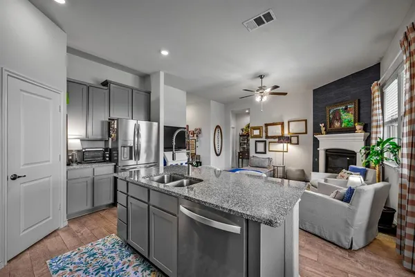 a view of a dining room with furniture and a window