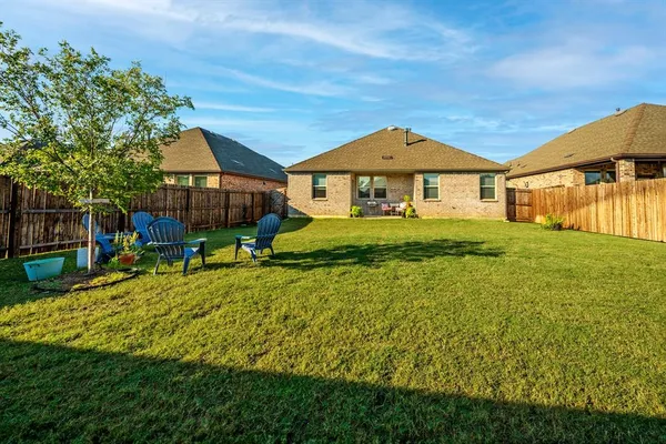 a house view with swimming pool in front of it