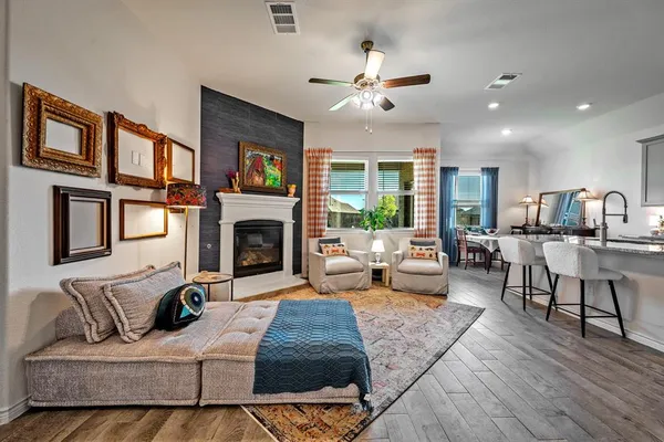 a living room with furniture fireplace and a flat screen tv