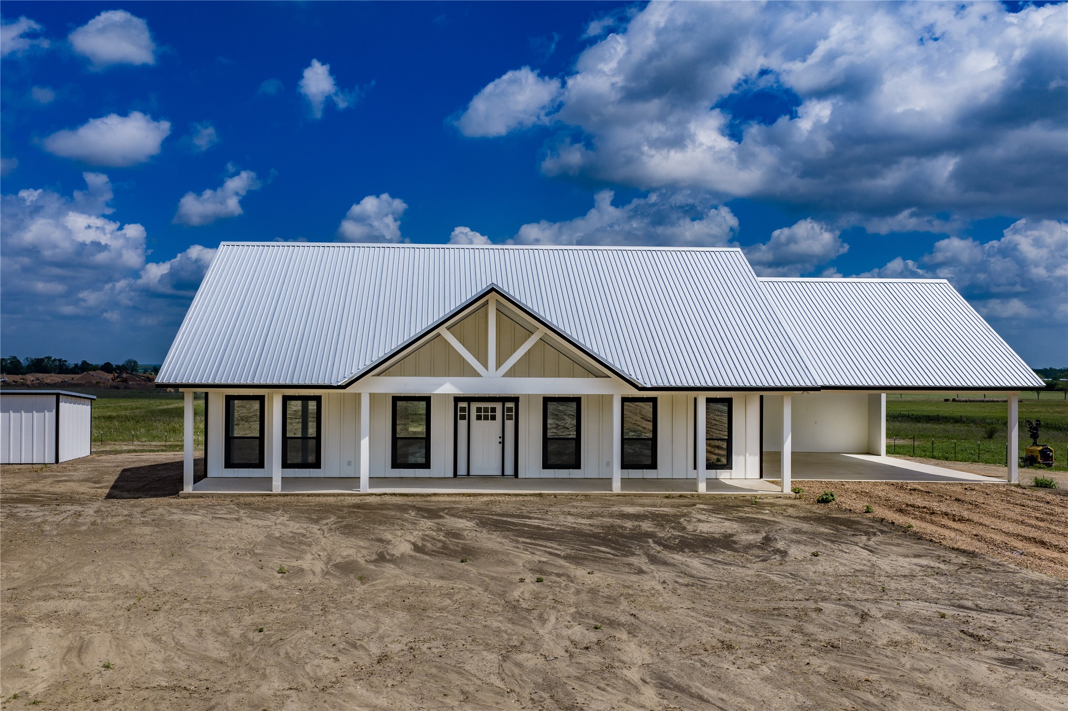 9391 Hajovsky Road La Grange, TX 78945 - Photo 1 of 22 a front view of a house with a garden