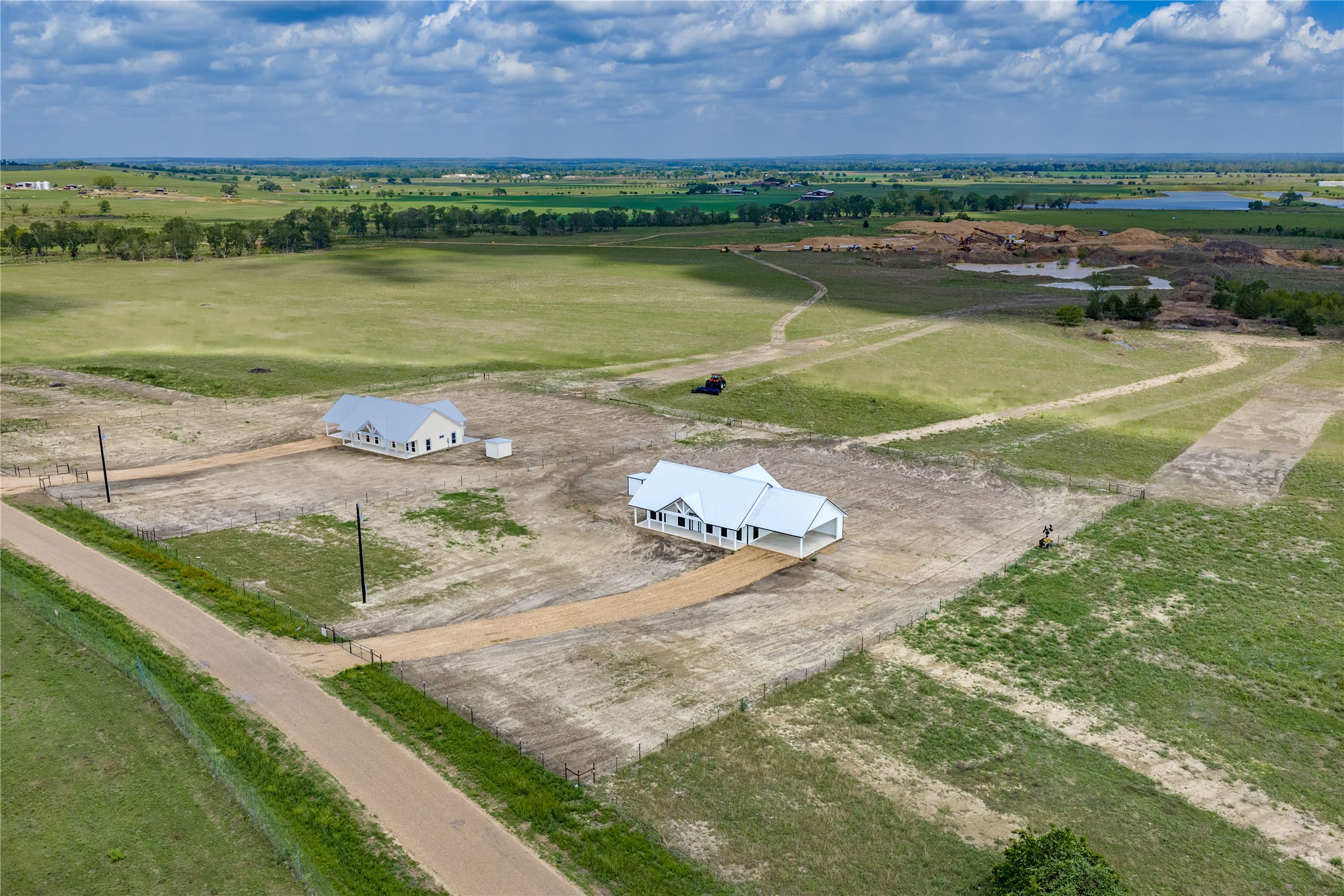 9391 Hajovsky Road La Grange, TX 78945 - Photo 16 of 22 a view of a lake with a house in the background