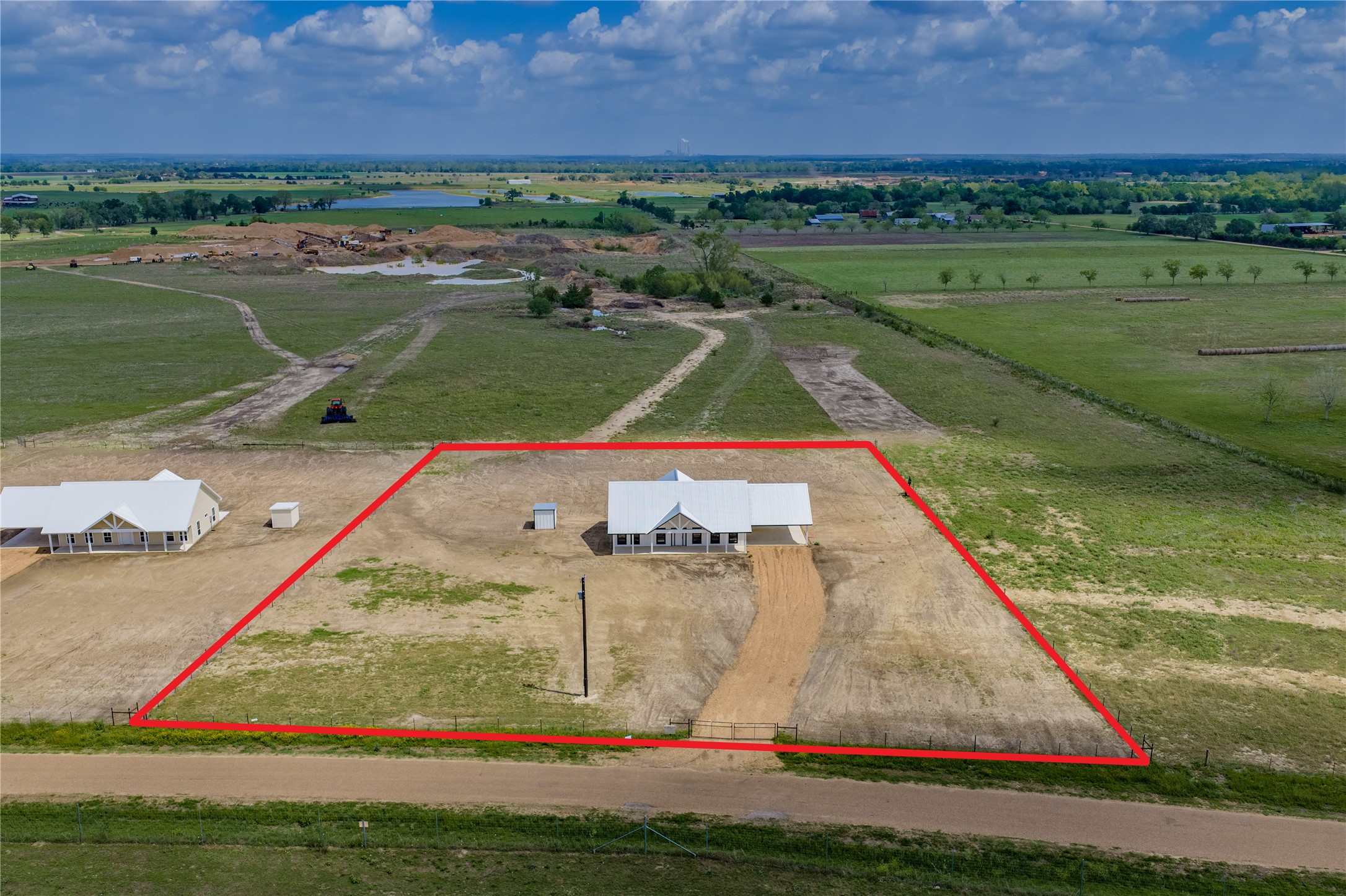 9391 Hajovsky Road La Grange, TX 78945 - Photo 22 of 22 an aerial view of a golf course with a lake view