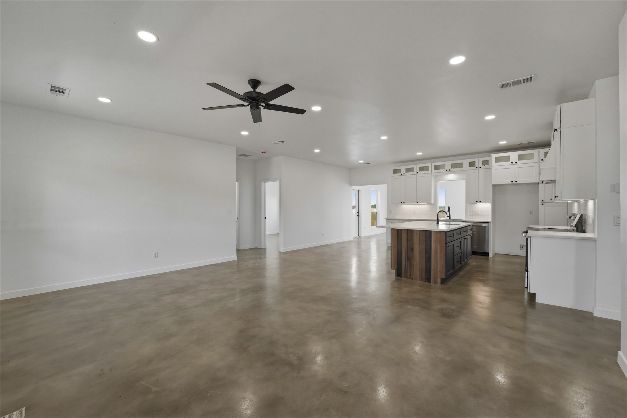 9391 Hajovsky Road La Grange, TX 78945 - Photo 4 of 22 a view of a kitchen with kitchen island a sink stainless steel appliances and cabinets