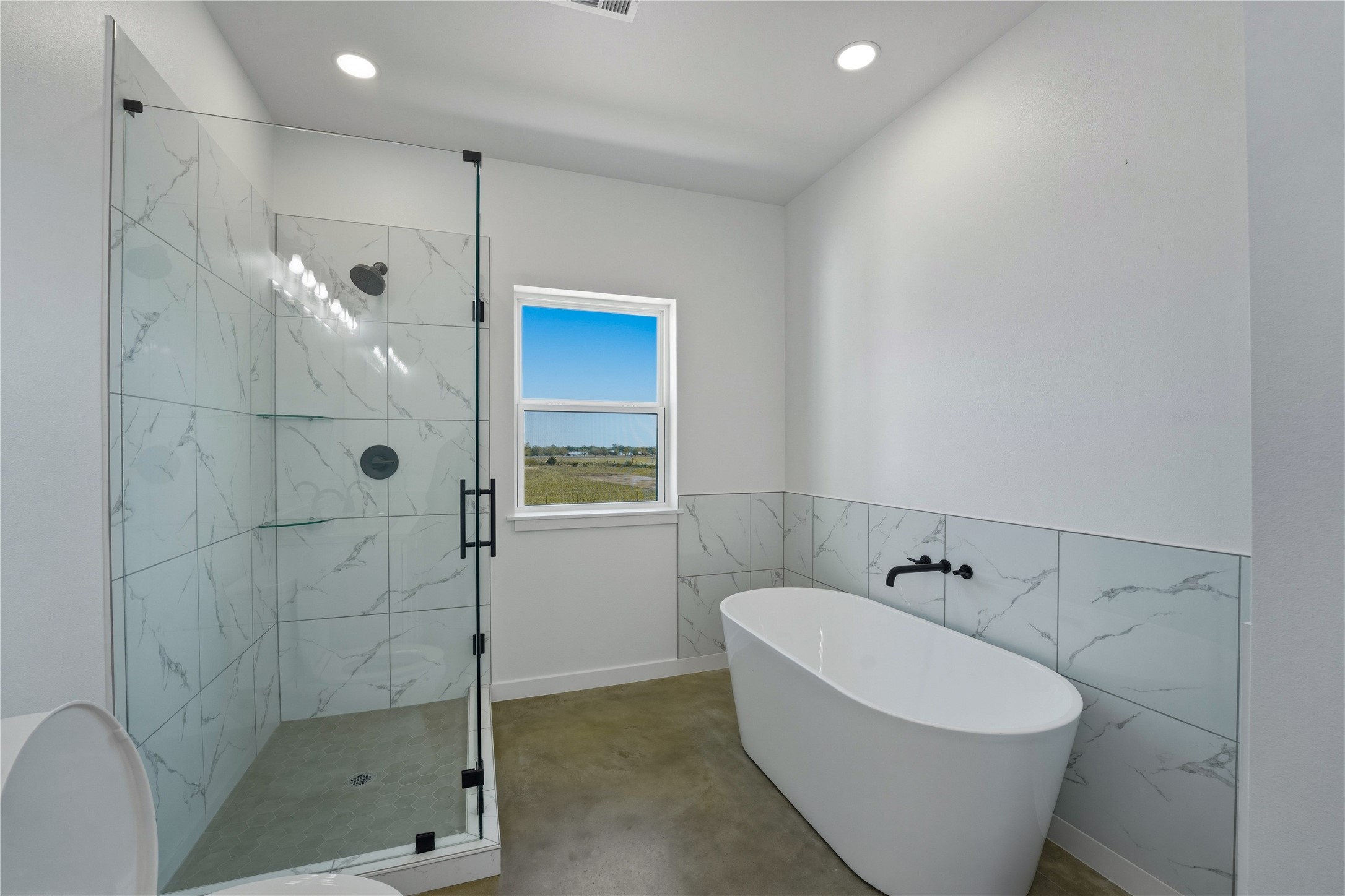 9391 Hajovsky Road La Grange, TX 78945 - Photo 7 of 22 a bathroom with a bathtub and shower