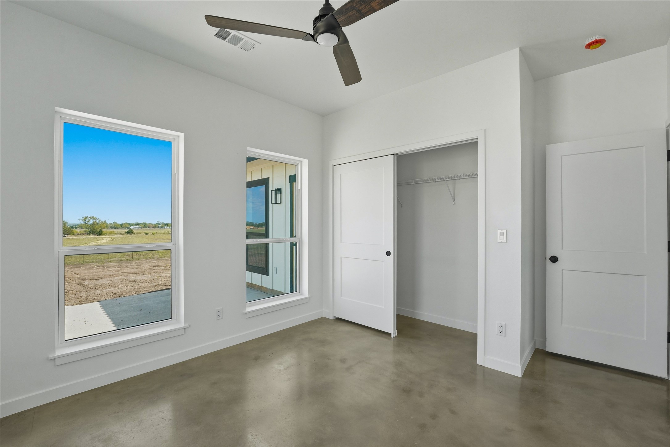 9391 Hajovsky Road La Grange, TX 78945 - Photo 10 of 22 a view of an empty room with glass door