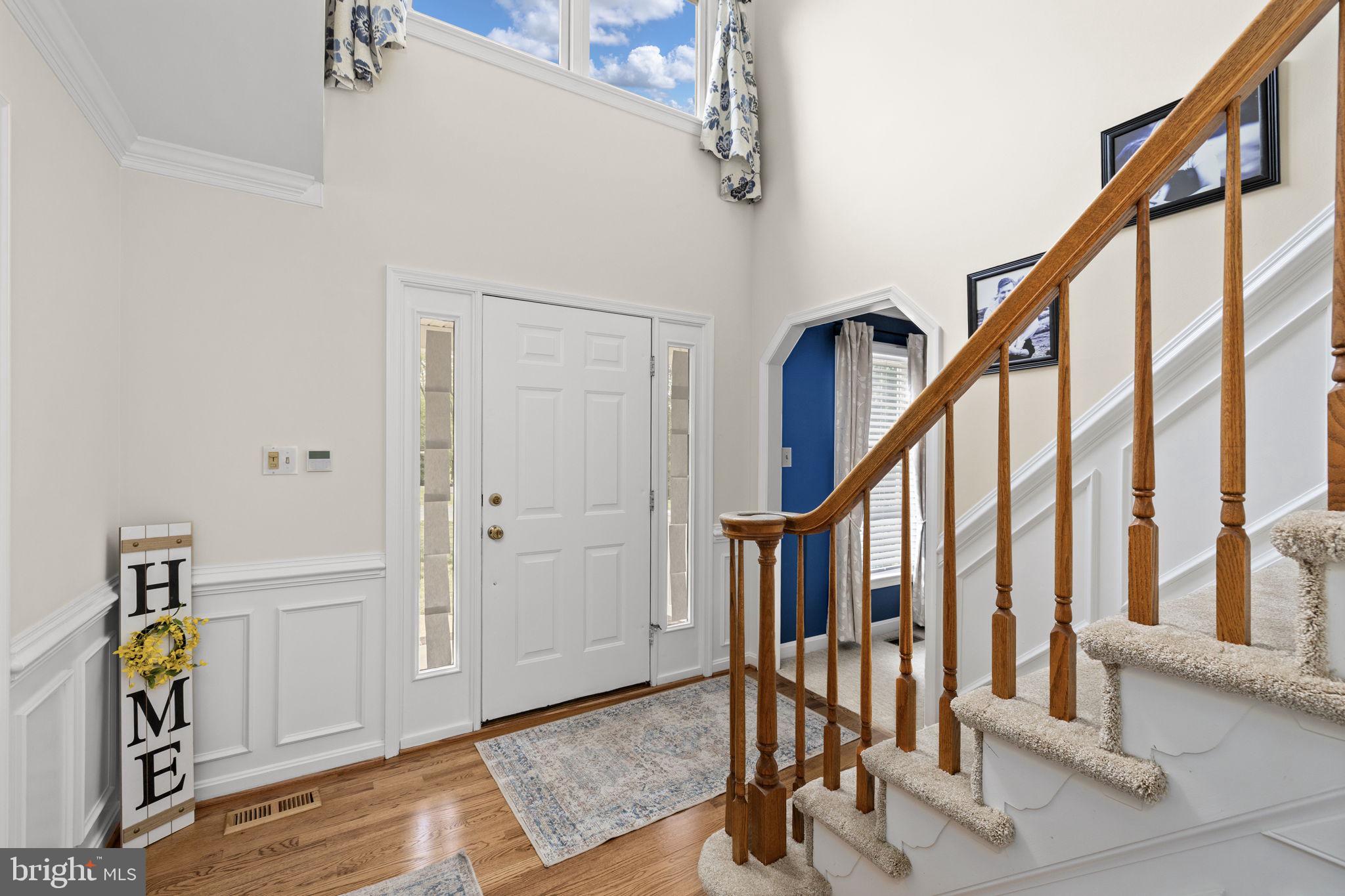 100 Boscobel Road Fredericksburg, VA 22405 - Photo 19 of 67 a view of an entryway with wooden floor and stairs