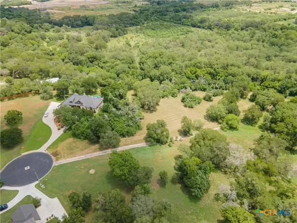 a view of a back yard of the house