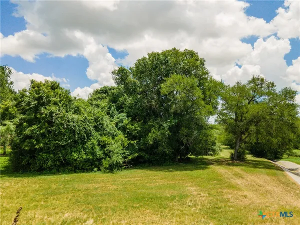 a view of a swimming pool with an outdoor space and seating area