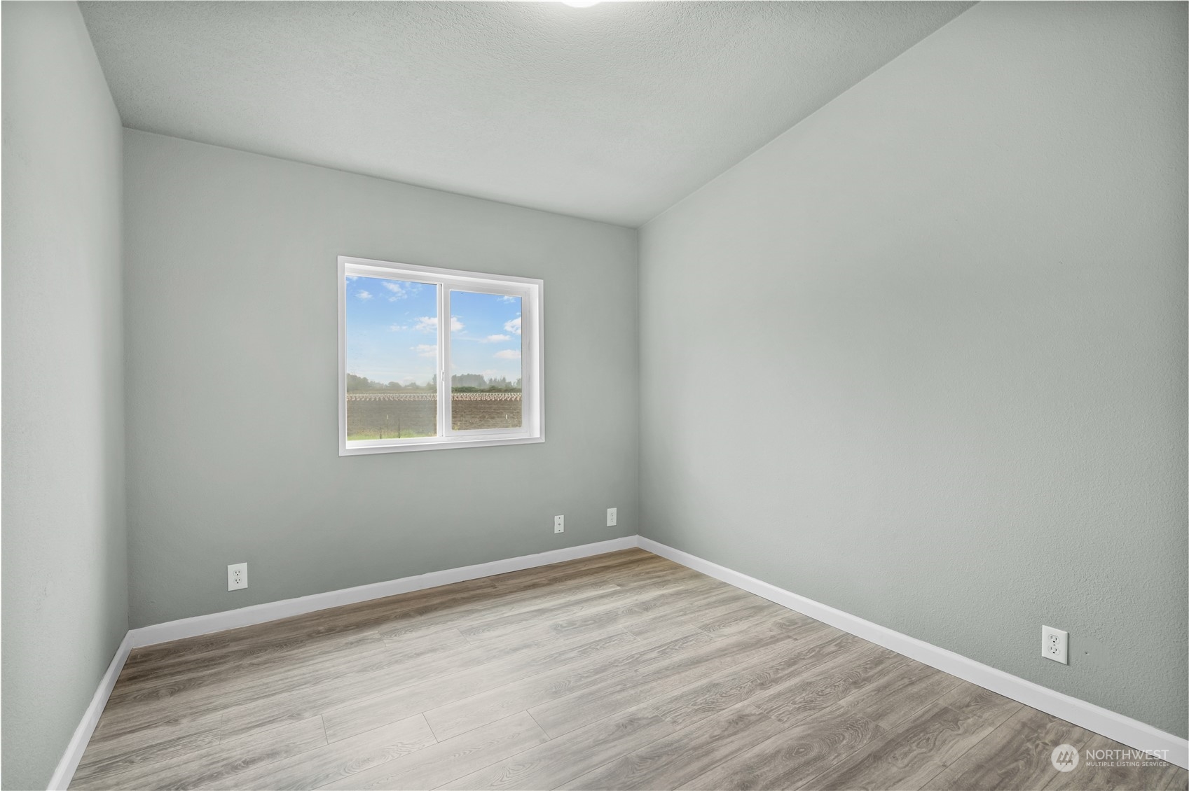 3796 Lindsay Road Everson, WA 98247 - Photo 25 of 37 a view of empty room with wooden floor