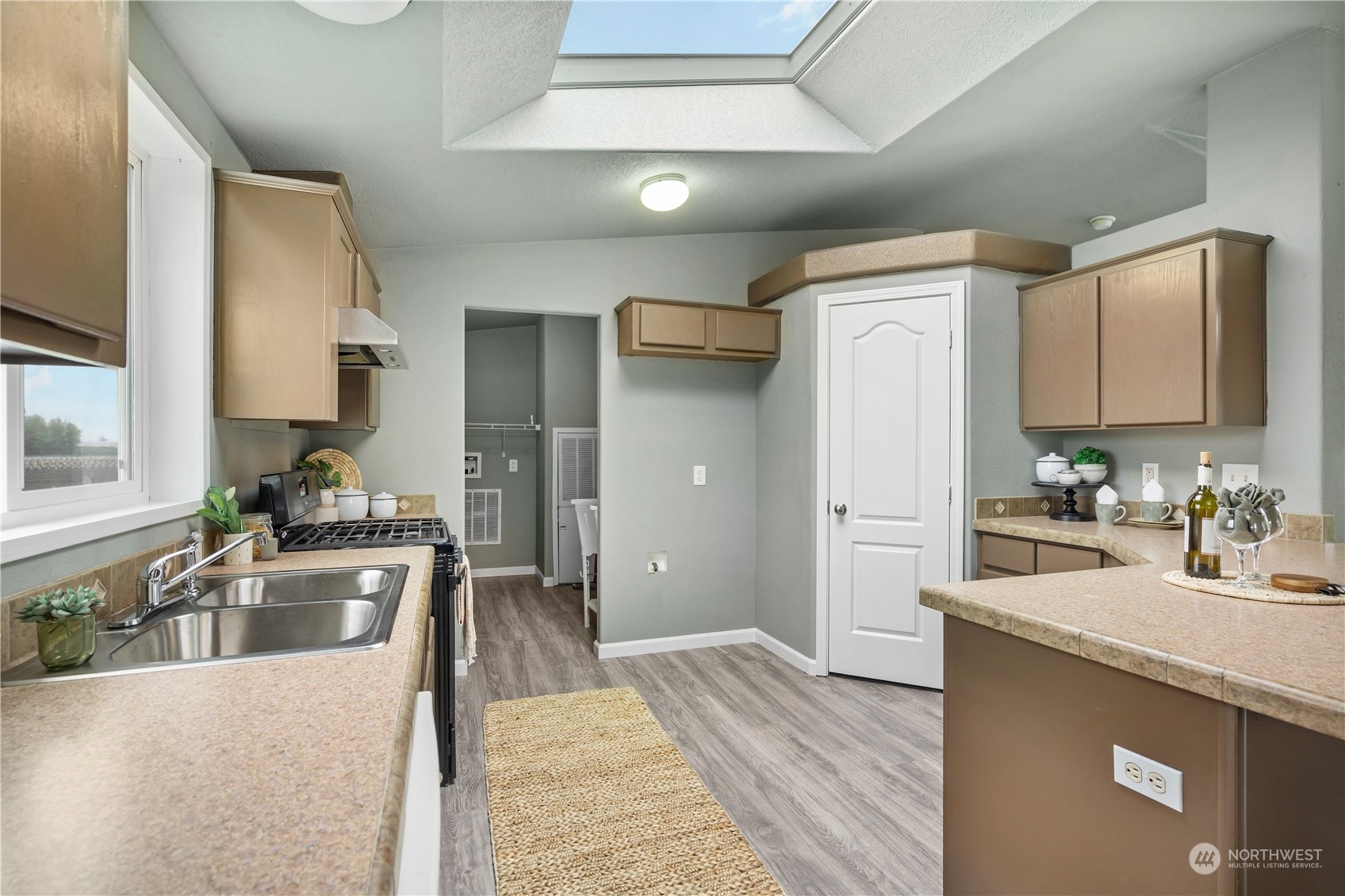 3796 Lindsay Road Everson, WA 98247 - Photo 8 of 37 a kitchen with stainless steel appliances granite countertop a sink stove and refrigerator