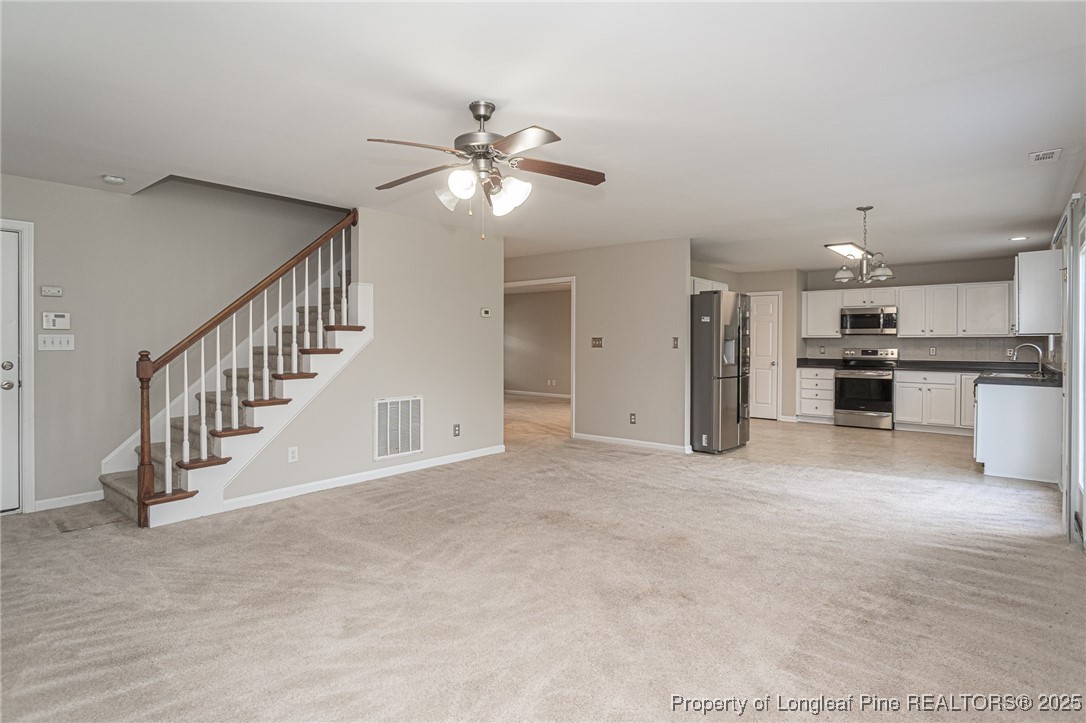 273 St George Drive Raeford, NC 28376 - Photo 14 of 38 a view of a livingroom with a ceiling fan