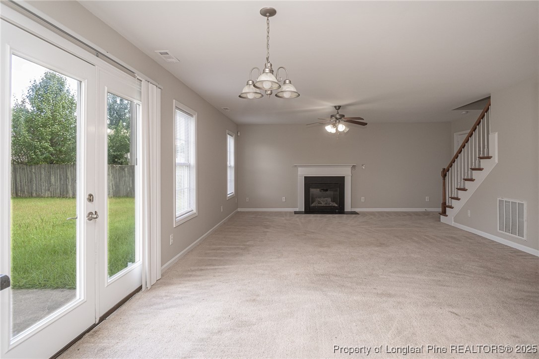 273 St George Drive Raeford, NC 28376 - Photo 15 of 38 a view of an empty room with a fireplace and a window