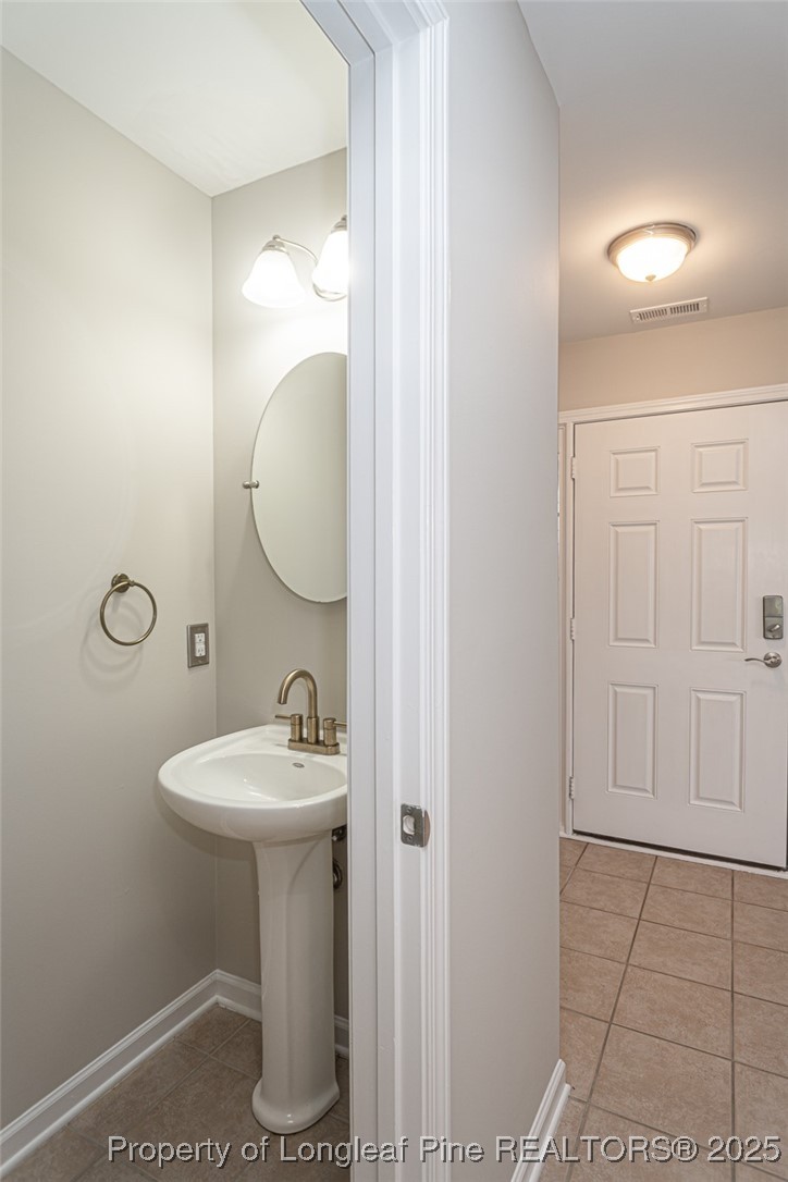 273 St George Drive Raeford, NC 28376 - Photo 16 of 38 a bathroom with a sink toilet and vanity