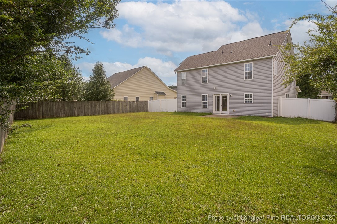 273 St George Drive Raeford, NC 28376 - Photo 2 of 38 a view of a house with a yard and a tree