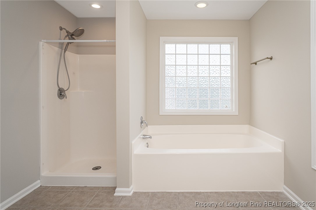 273 St George Drive Raeford, NC 28376 - Photo 22 of 38 a white bath tub with a shower