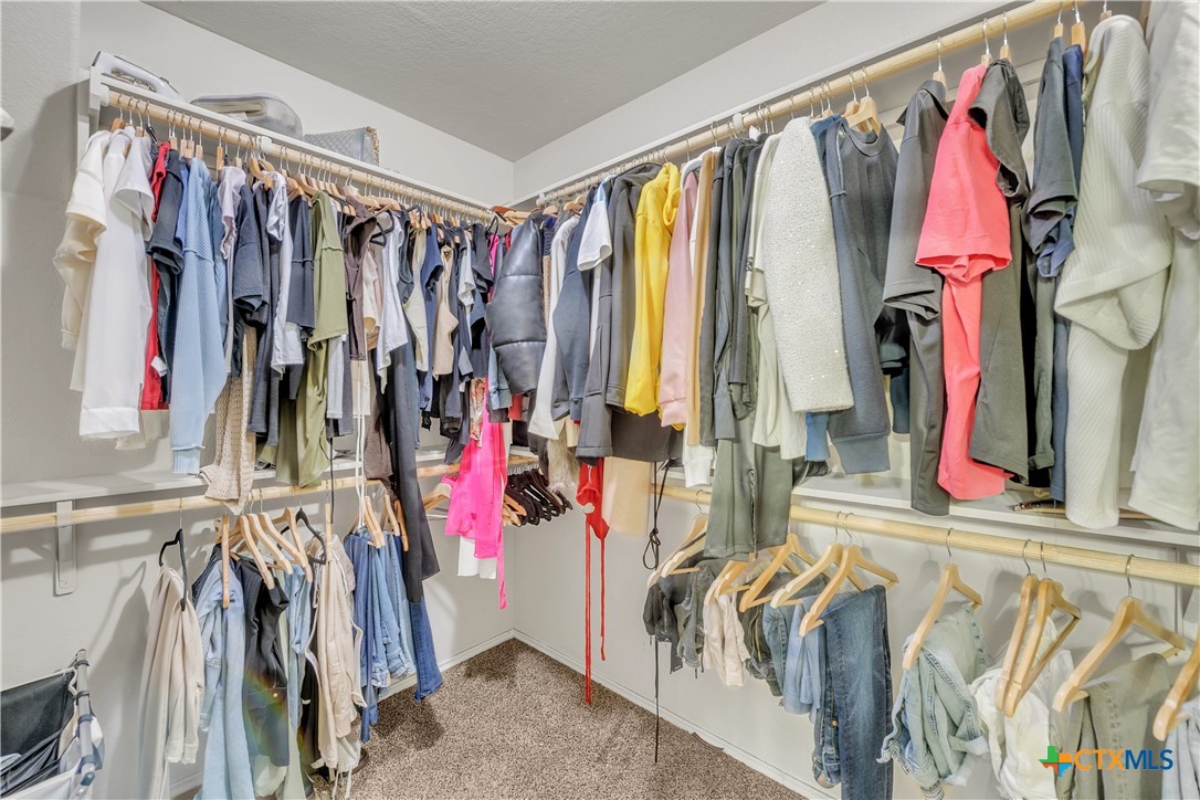 5577 Perdita Drive Belton, TX 76513 - Photo 16 of 25 a view of walk in closet with clothes