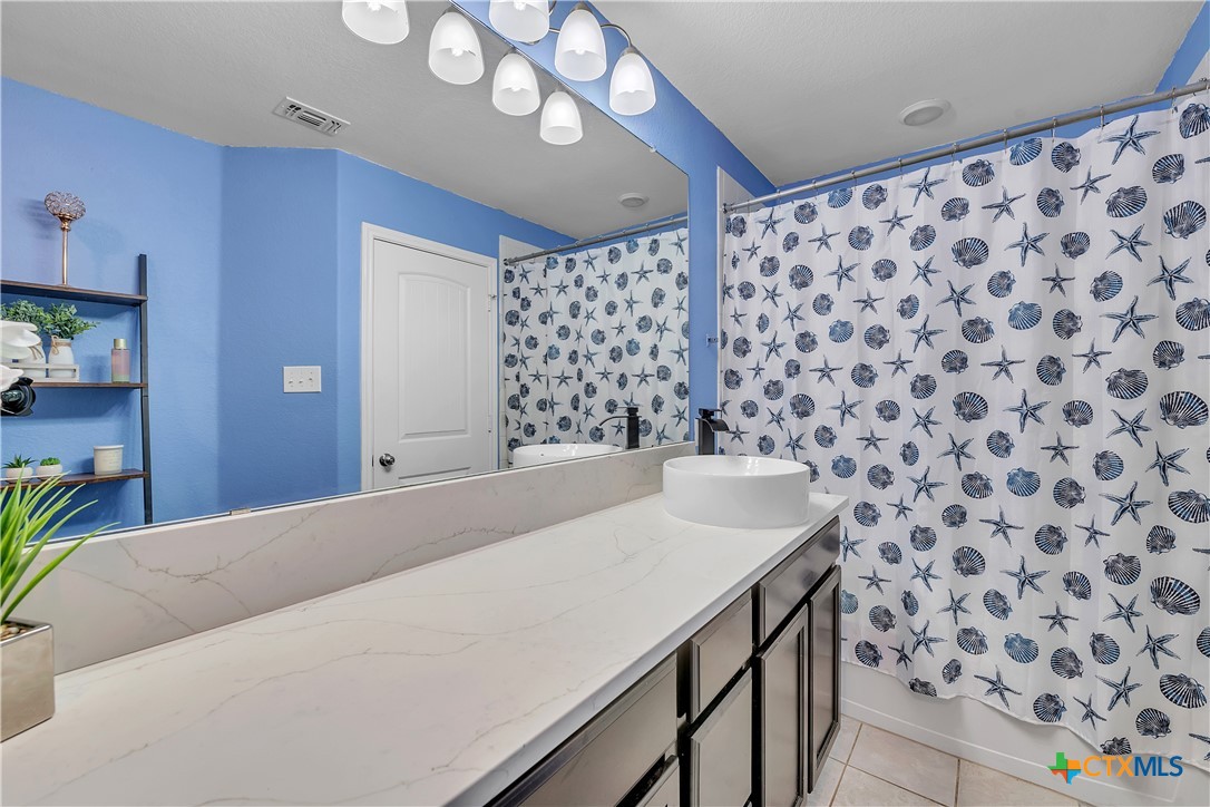 5577 Perdita Drive Belton, TX 76513 - Photo 22 of 25 a bathroom with a sink and a mirror