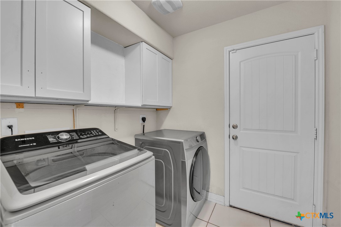 5577 Perdita Drive Belton, TX 76513 - Photo 24 of 25 a utility room with dryer and washer