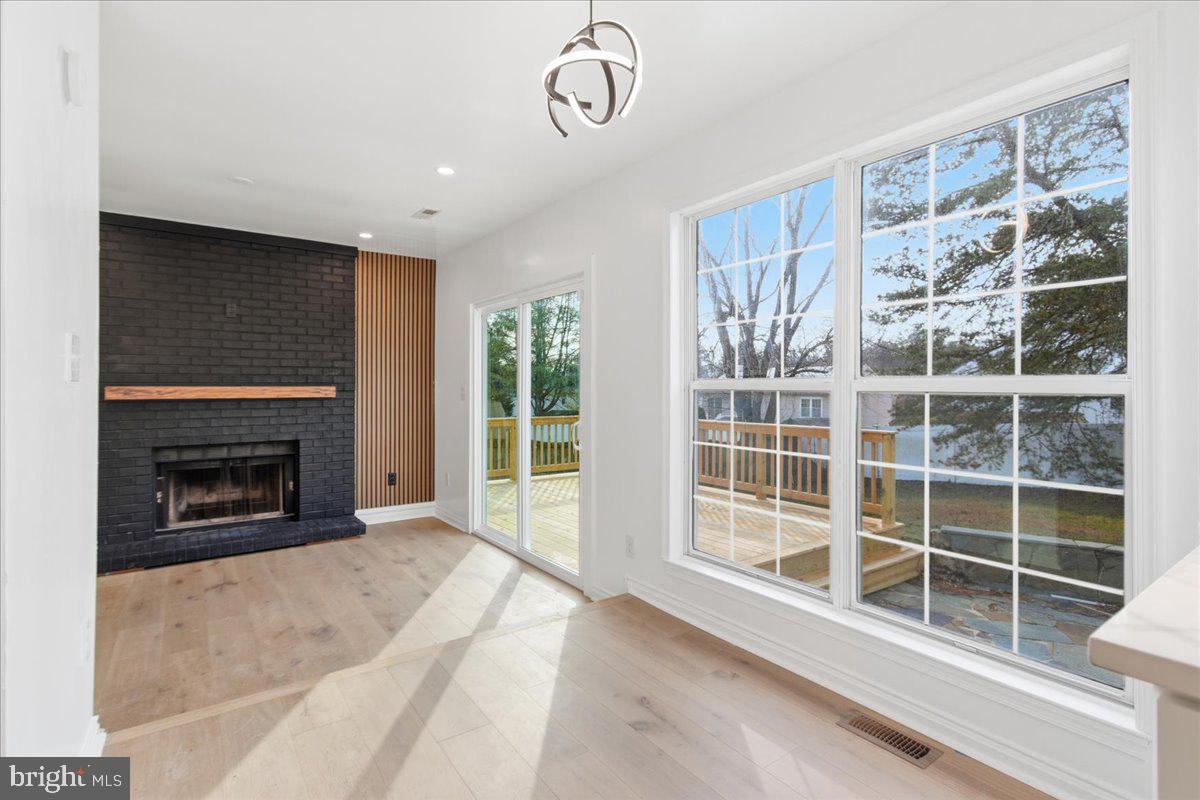 9409 Silver Fox Turn Clinton, MD 20735 - Photo 12 of 33 a view of an empty room with a window and fireplace
