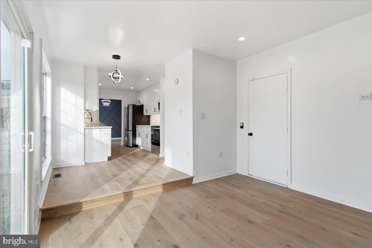 9409 Silver Fox Turn Clinton, MD 20735 - Photo 14 of 33 a view of a kitchen with a refrigerator and a sink