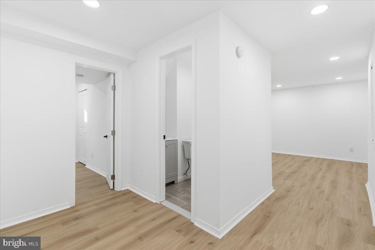 9409 Silver Fox Turn Clinton, MD 20735 - Photo 26 of 33 a view of hallway with wooden floor