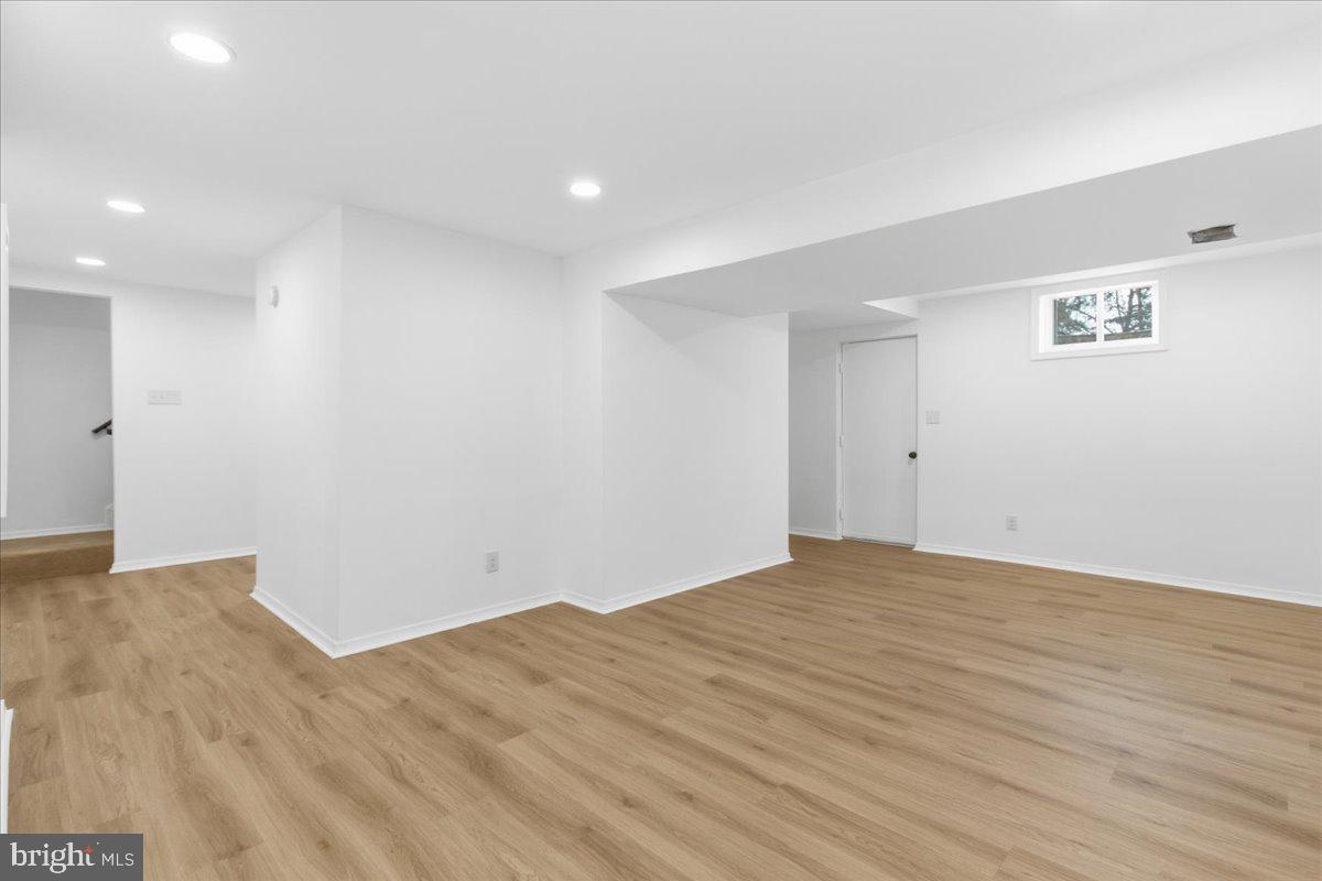 9409 Silver Fox Turn Clinton, MD 20735 - Photo 27 of 33 a view of empty room with wooden floor